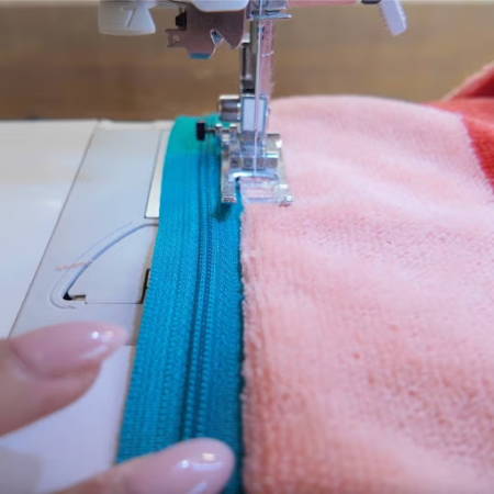 Topstitching along the zipper, panel folded back flat