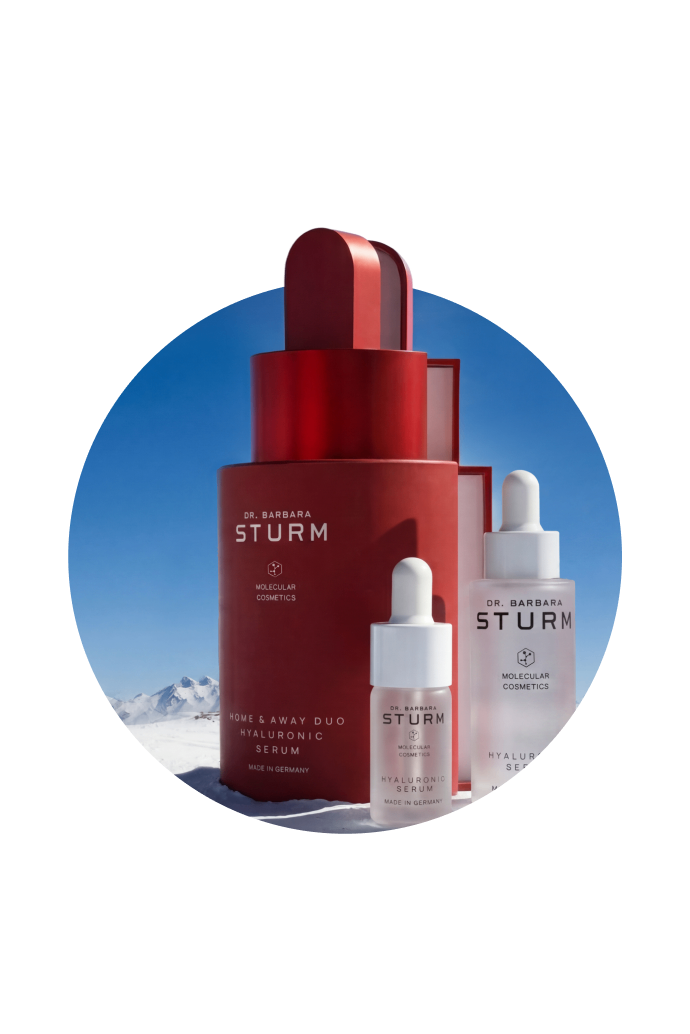 Skincare products displayed against a snowy mountain backdrop.