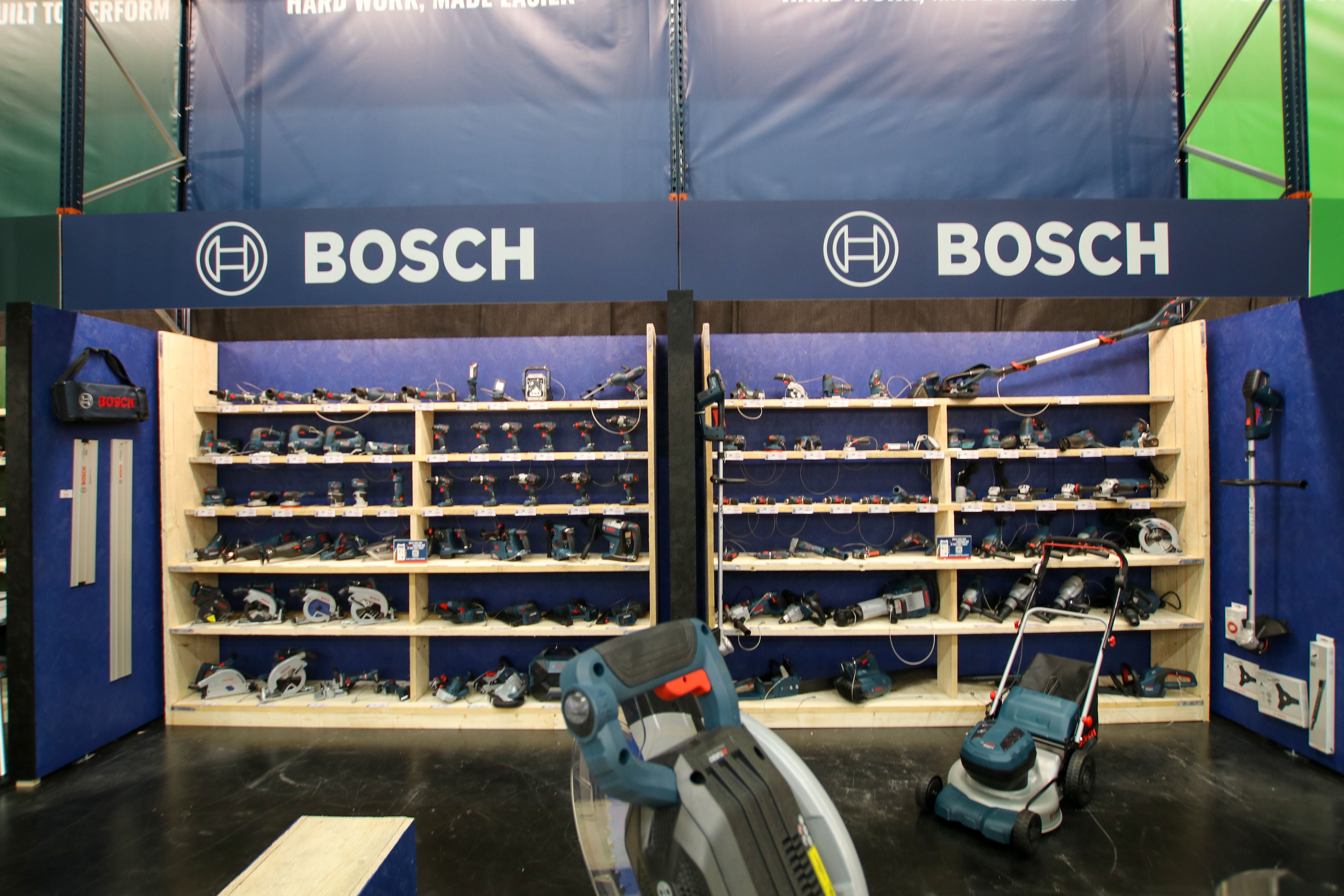 Bosch display with tools and equipment on shelves.