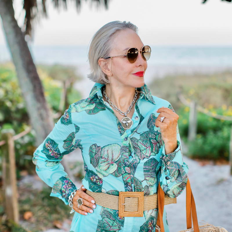 Close up image of Sheree Frede wearing green cotton shirt blouse with belt and bag in Sanibel Island by Ala von Auersperg