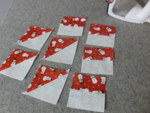 pressed quilt squares with a christmas fabric