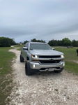 Front three-quarter silver 2018 Chevrolet Silverado 1500 Z71 on gravel road Jackson's Outlaw 228H install thumbnail