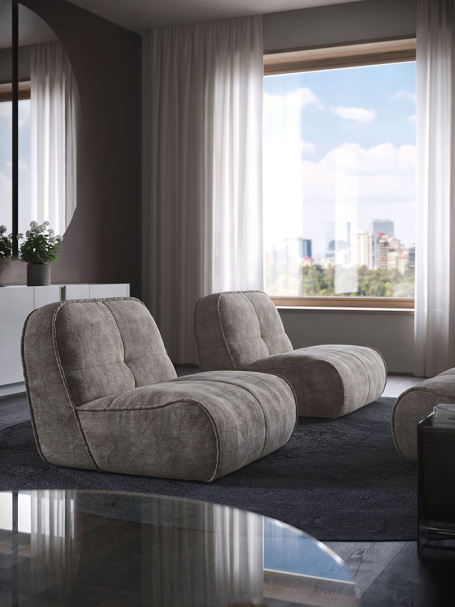 Two modern gray Spener lounge chairs by Cattelan Italia in a bright, stylish living room.