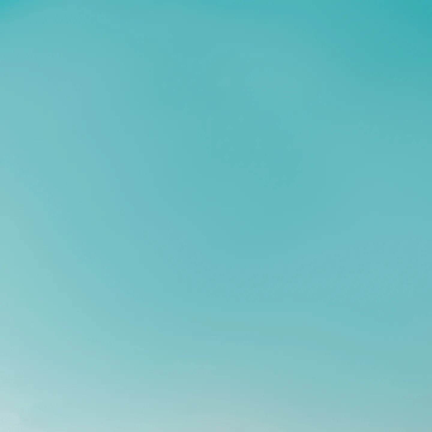 A smooth gradient background in shades of light blue.
