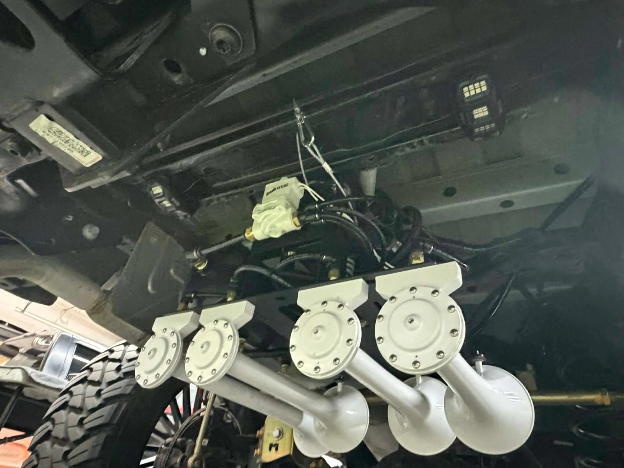 Patrick's 2024 Jeep Gladiator train horn installation detail with Spare Tire Delete Kit photo 3