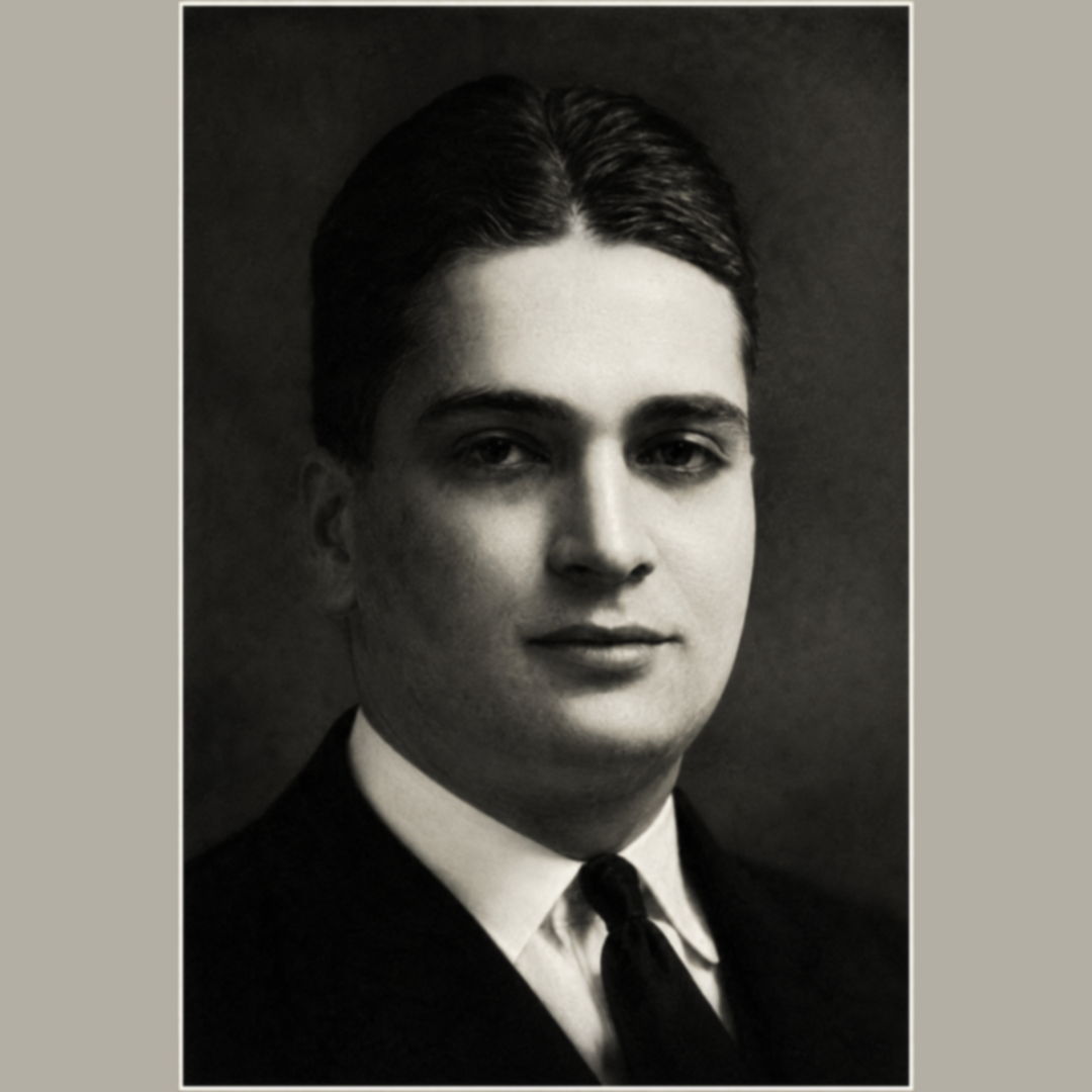 Black and white portrait of a young man in a suit and tie.