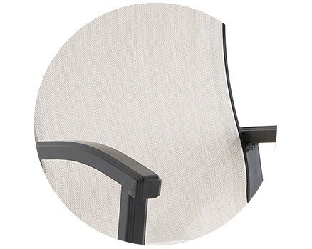 Close-up of a modern chair's armrest and seat design.
