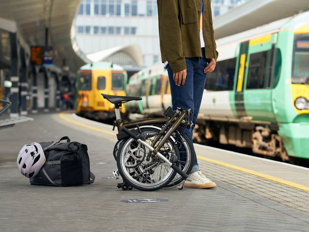 Brompton Bike Folded On A  Train Platform