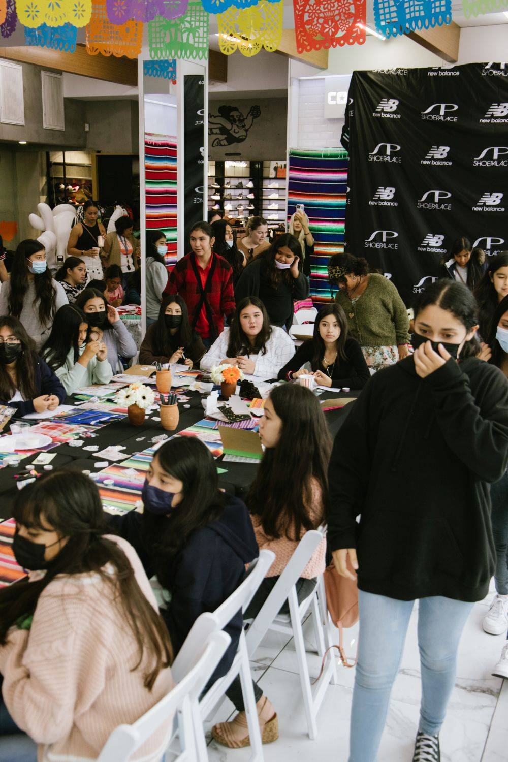 hispanic heritage month x new balance girls siting at a table