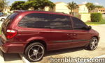 Rear three-quarter maroon Dodge Caravan Grand Cargo chrome wheels tinted windows palm trees residential Leonard's Conductor's Special 232 featured gallery photo 1