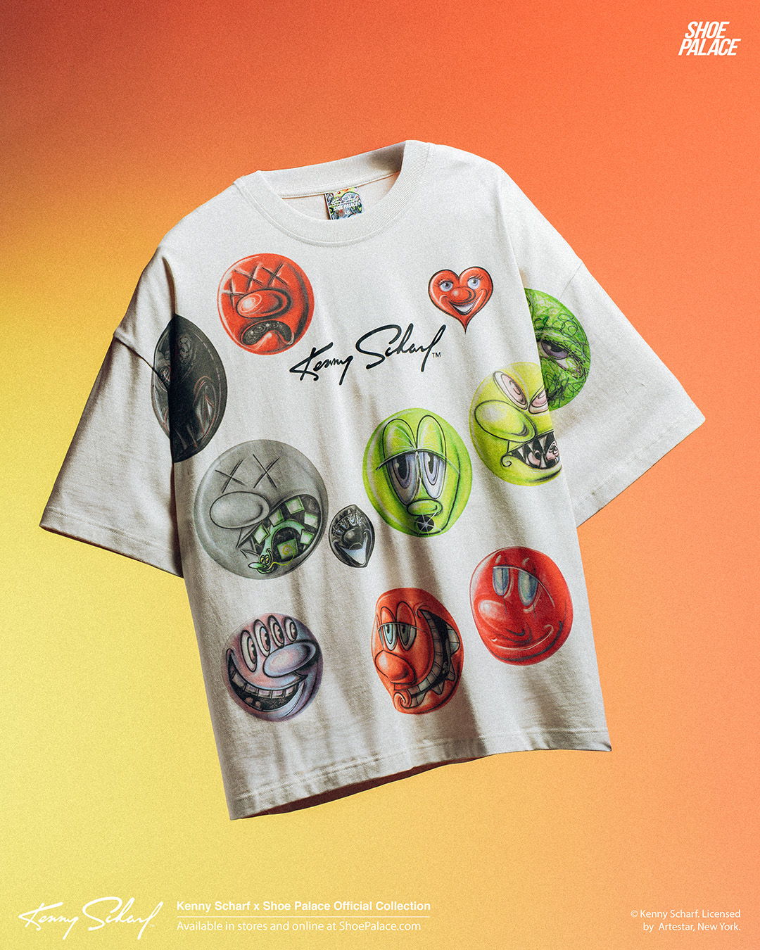 A graphic t-shirt with colorful smiley faces on a gradient background.