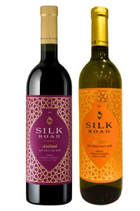 Two bottles of Silk Road wine, one red and one white.
