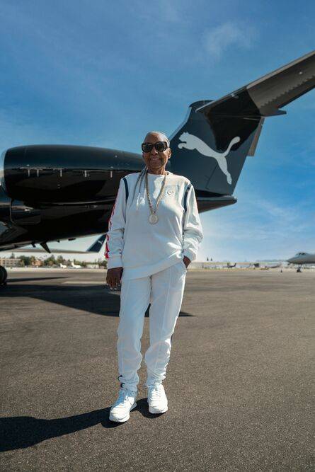 granny in front of plane in PUMA x TMC: THE HUSSLE WAY | LL Collection