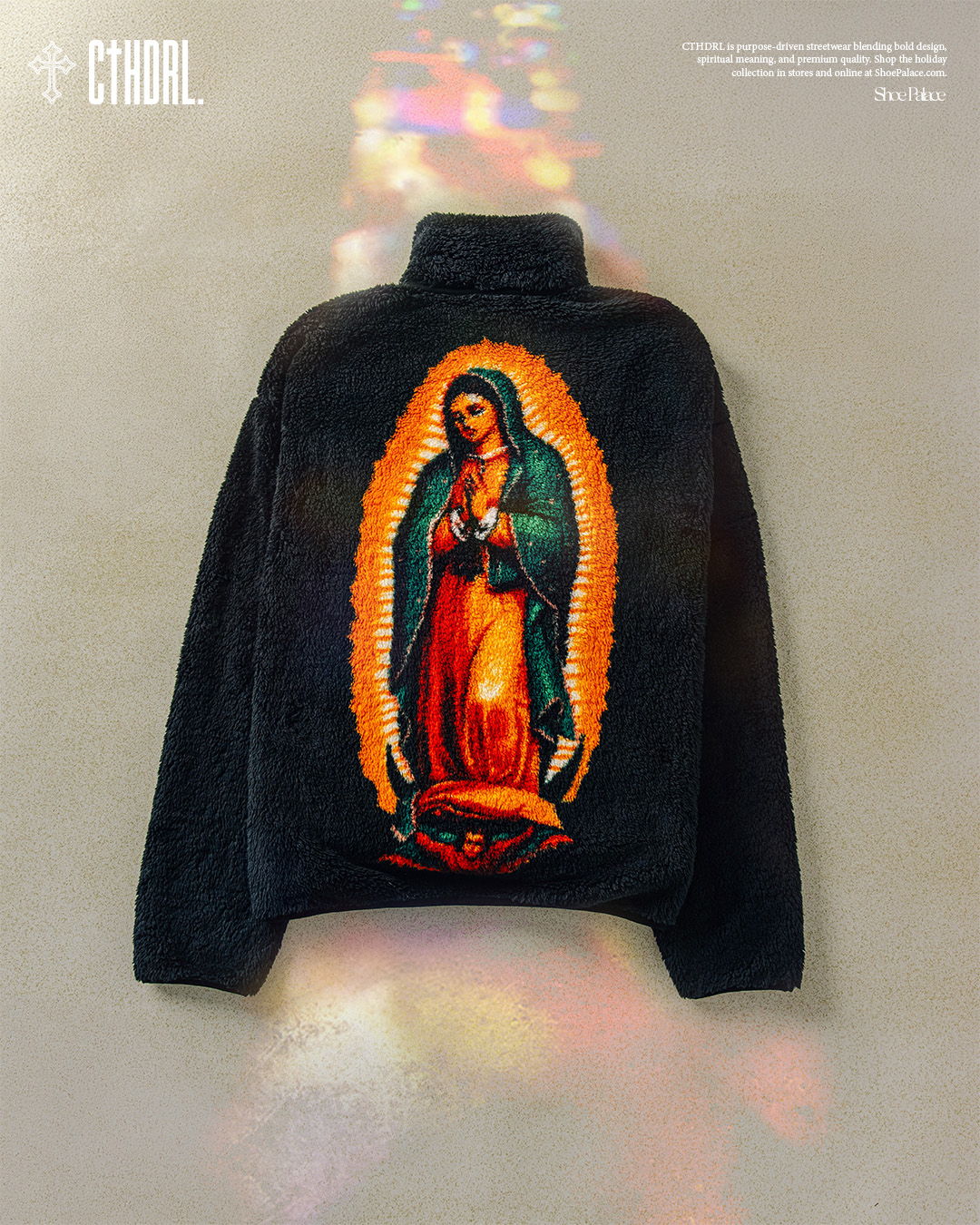 Black fleece jacket featuring an image of the Virgin Mary.