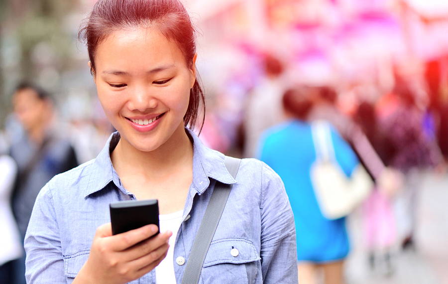 woman looking at her phone