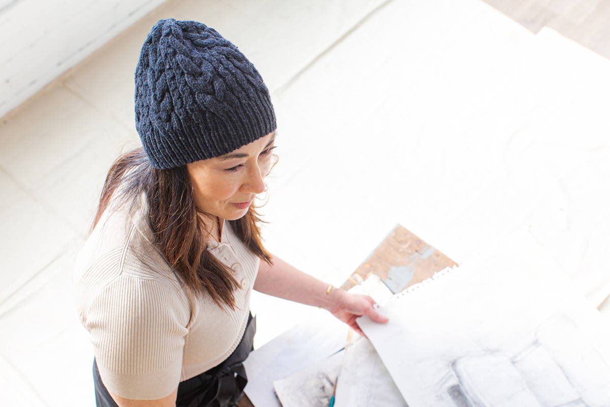 Laura modeling Woven Roots Hat in Carbon (beanie version)
