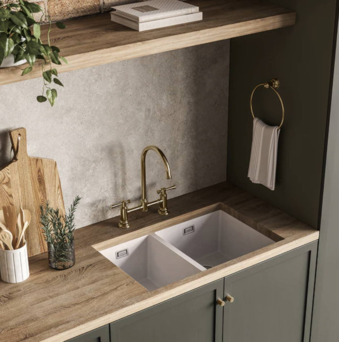 Modern white kitchen sink with sage kitchen cabinetry and traditional style tap ware  