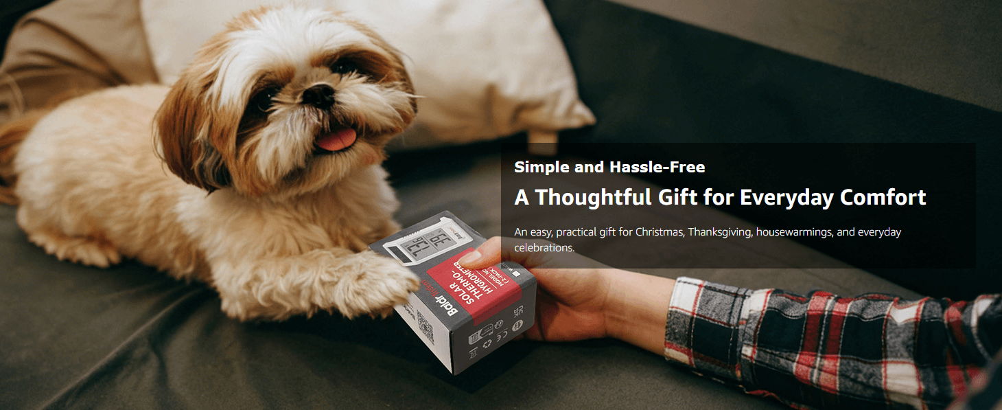 A dog receiving a gift box from a person's hand.