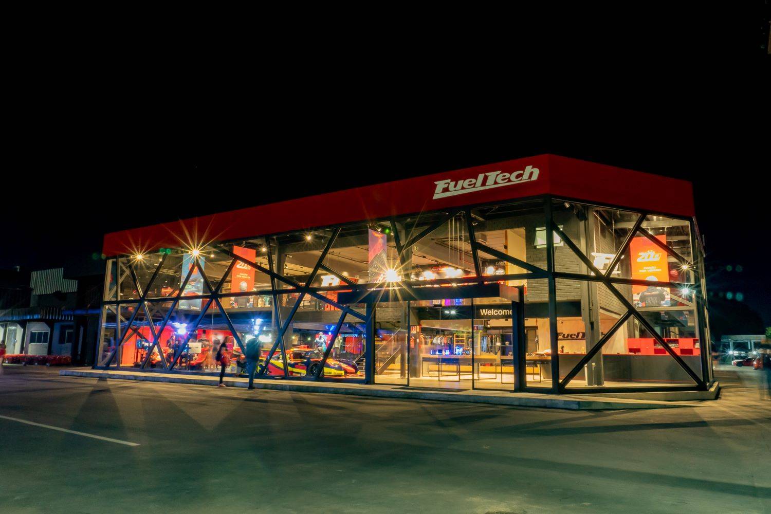 A nighttime view of the FT STORE at FuelTech's new headquarters.