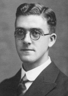Young Man wearing round glasses in a portrait in the 1920s