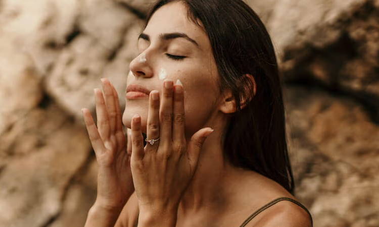 Applying mineral sunscreen in natural sunlight
