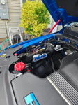 HornBlasters air compressor system installed in blue RAM 1500 engine bay