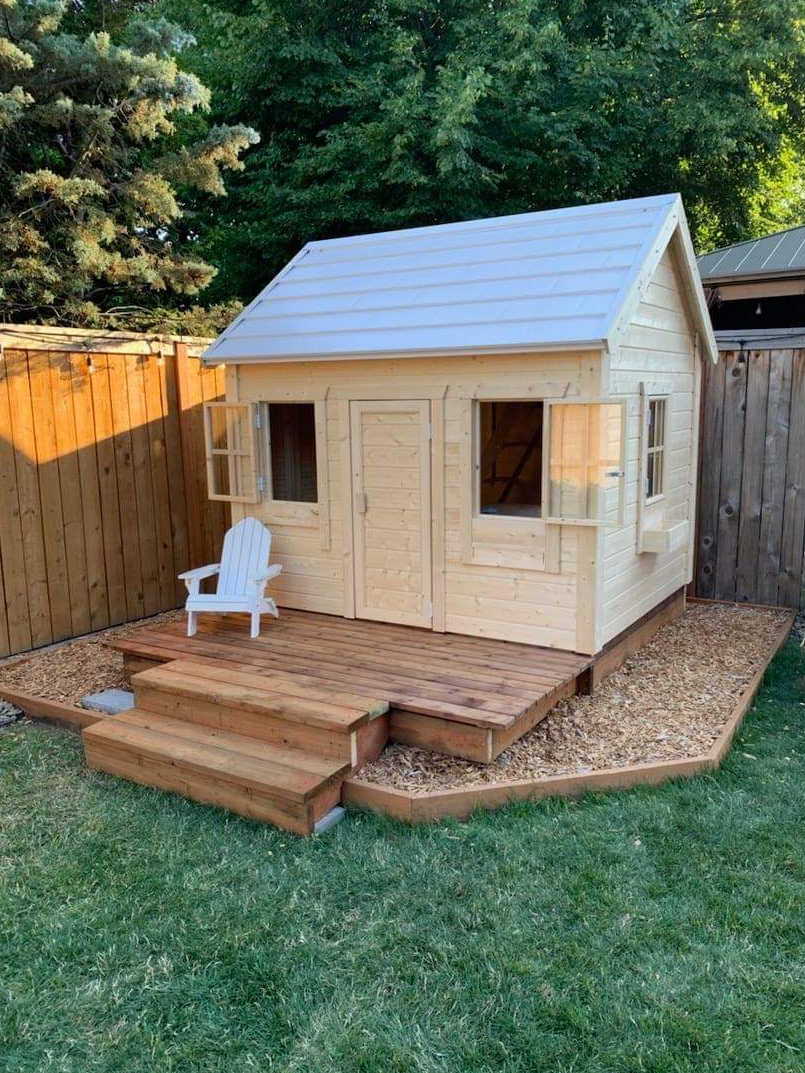 Wooden Playhouse Natural Wonder in Backyard, View from front, showing Three Windows with Flower Boxes by WholeWoodPlayhouses 