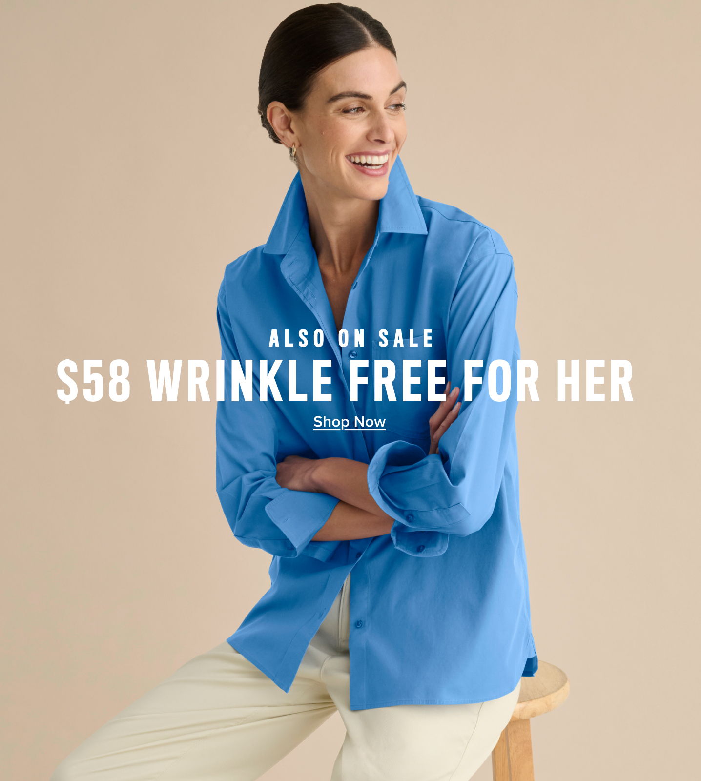 Woman smiling in a blue shirt, promoting a sale on wrinkle-free clothing.