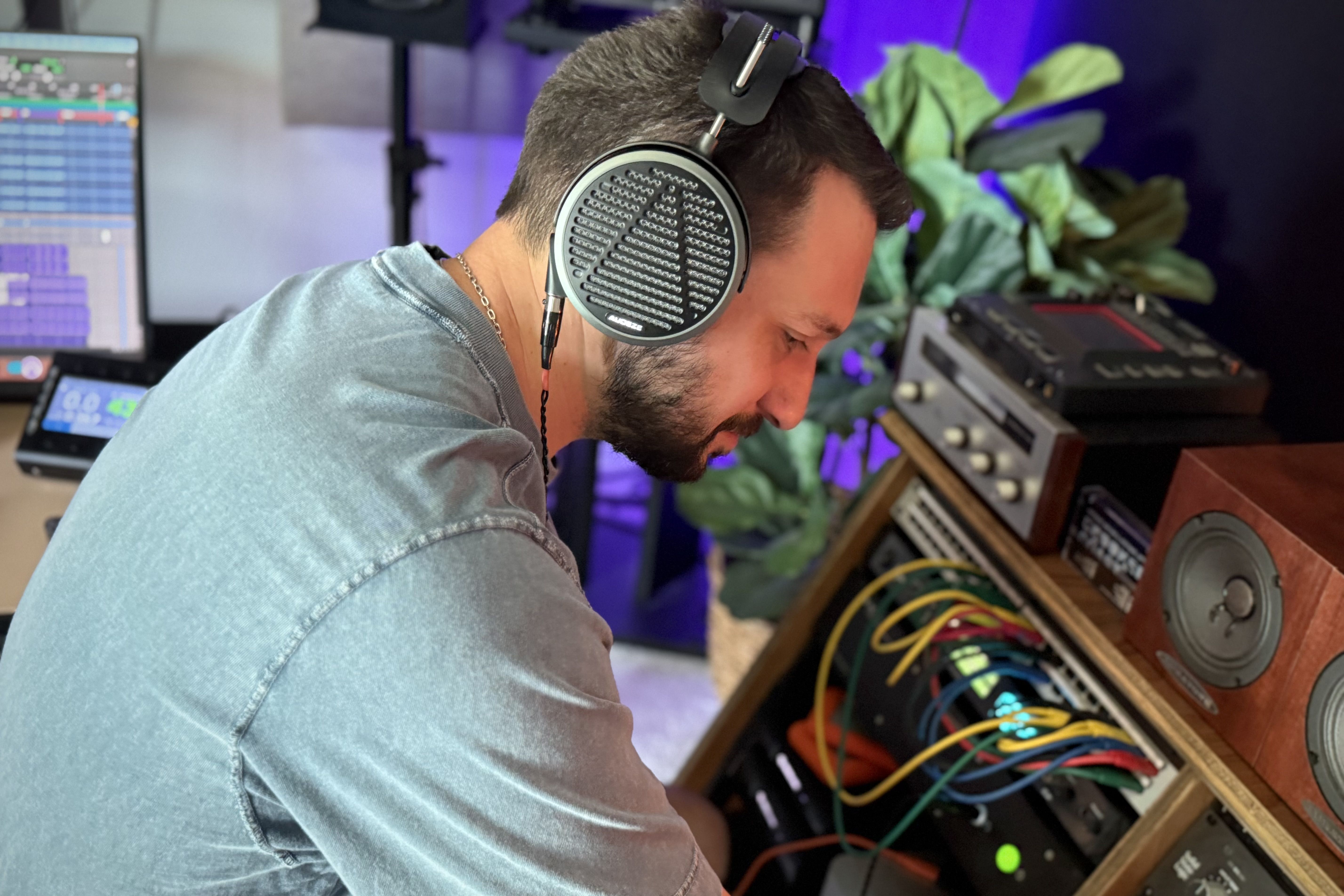 Mario Borgatta wearing Audeze MM-500 headphones mixing in the studio