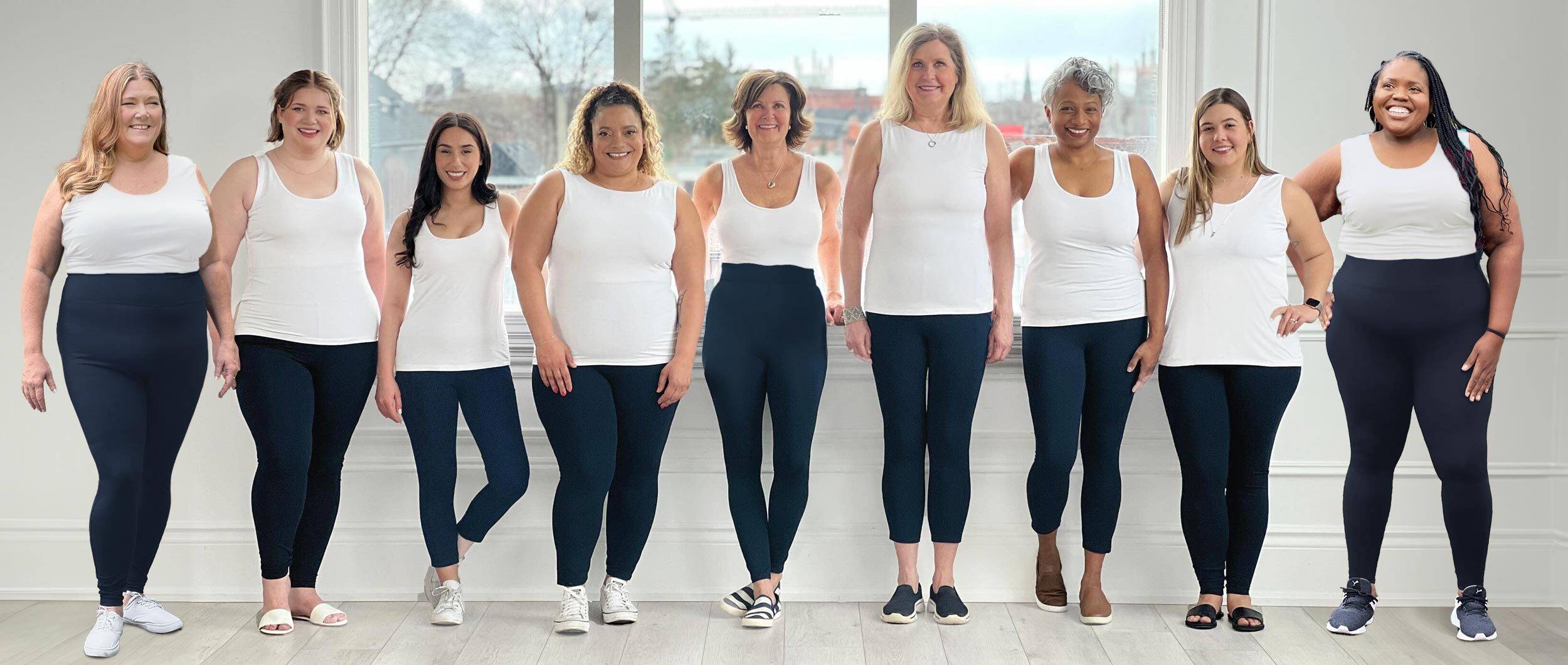 Group of women of different sized bodies wearing Miik sustainable leggings with their sizes written on their top