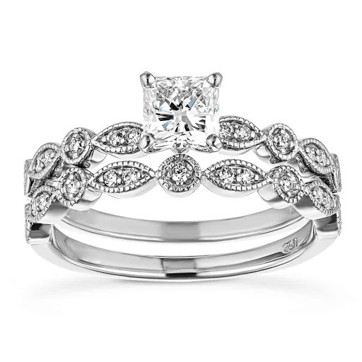 Vintage style white gold wedding ring set featuring filigrie and accented diamonds