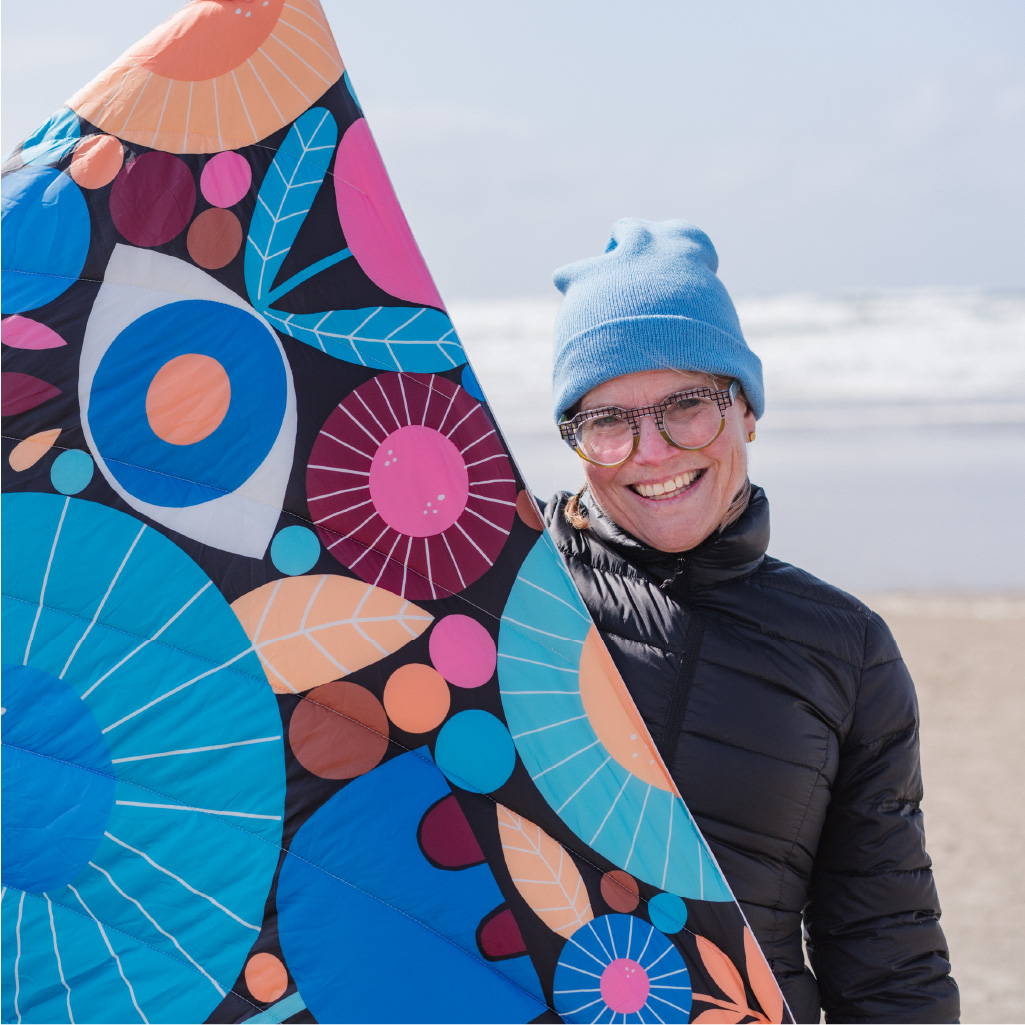 Lisa Congdon holding Night Garden Blanket