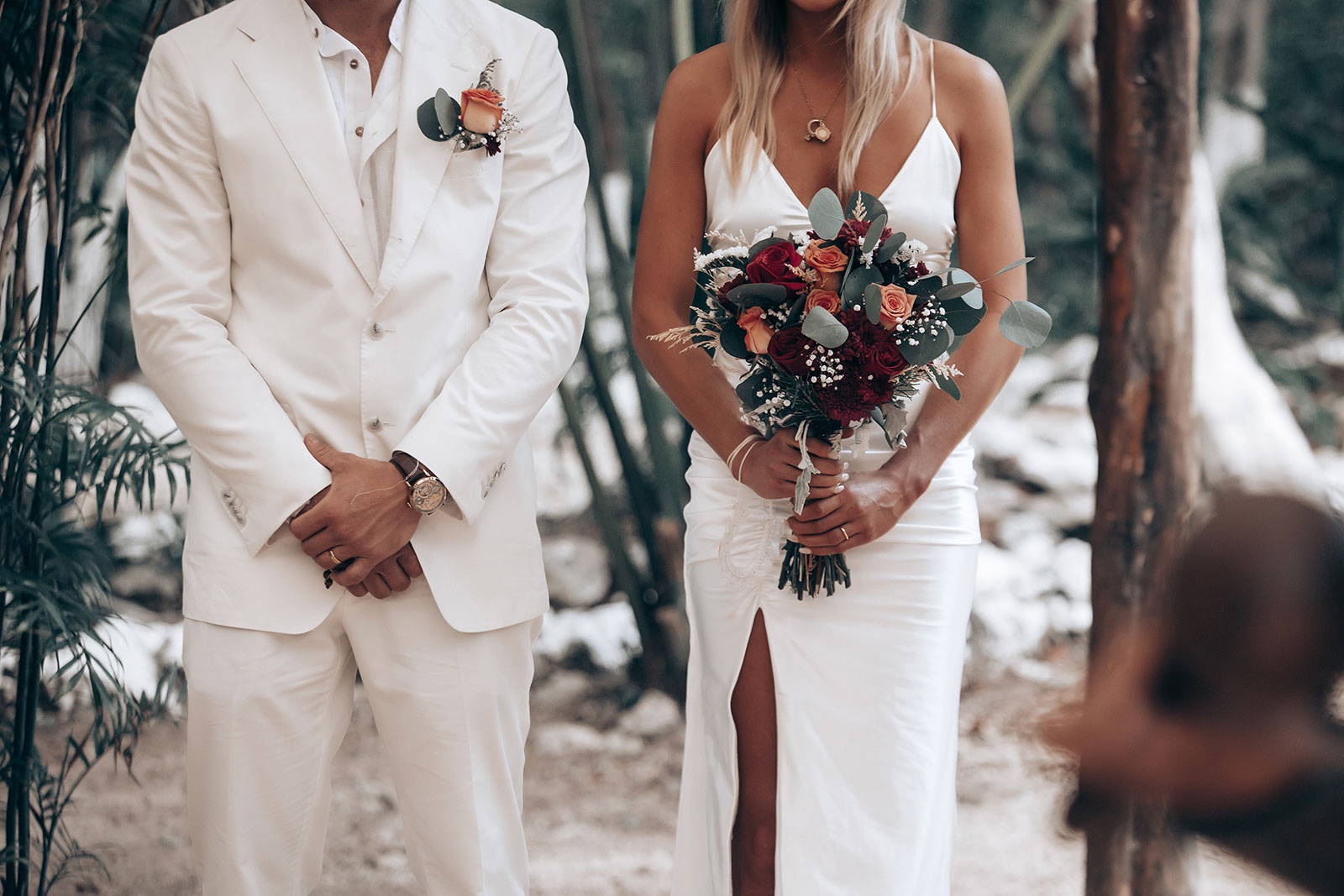 Bride and groom standing next to each other