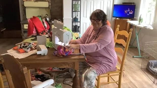 artist sewing adversity