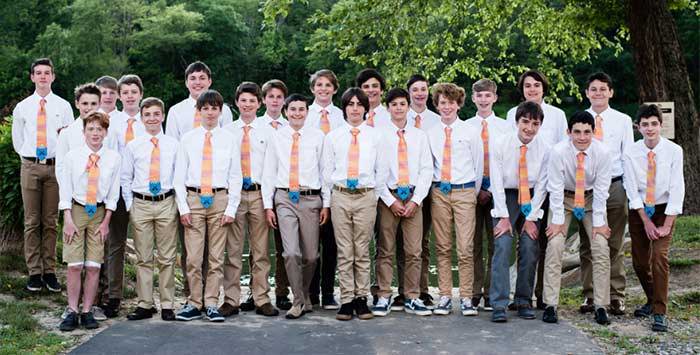 Large group of young teens wearing matching canoe neckties