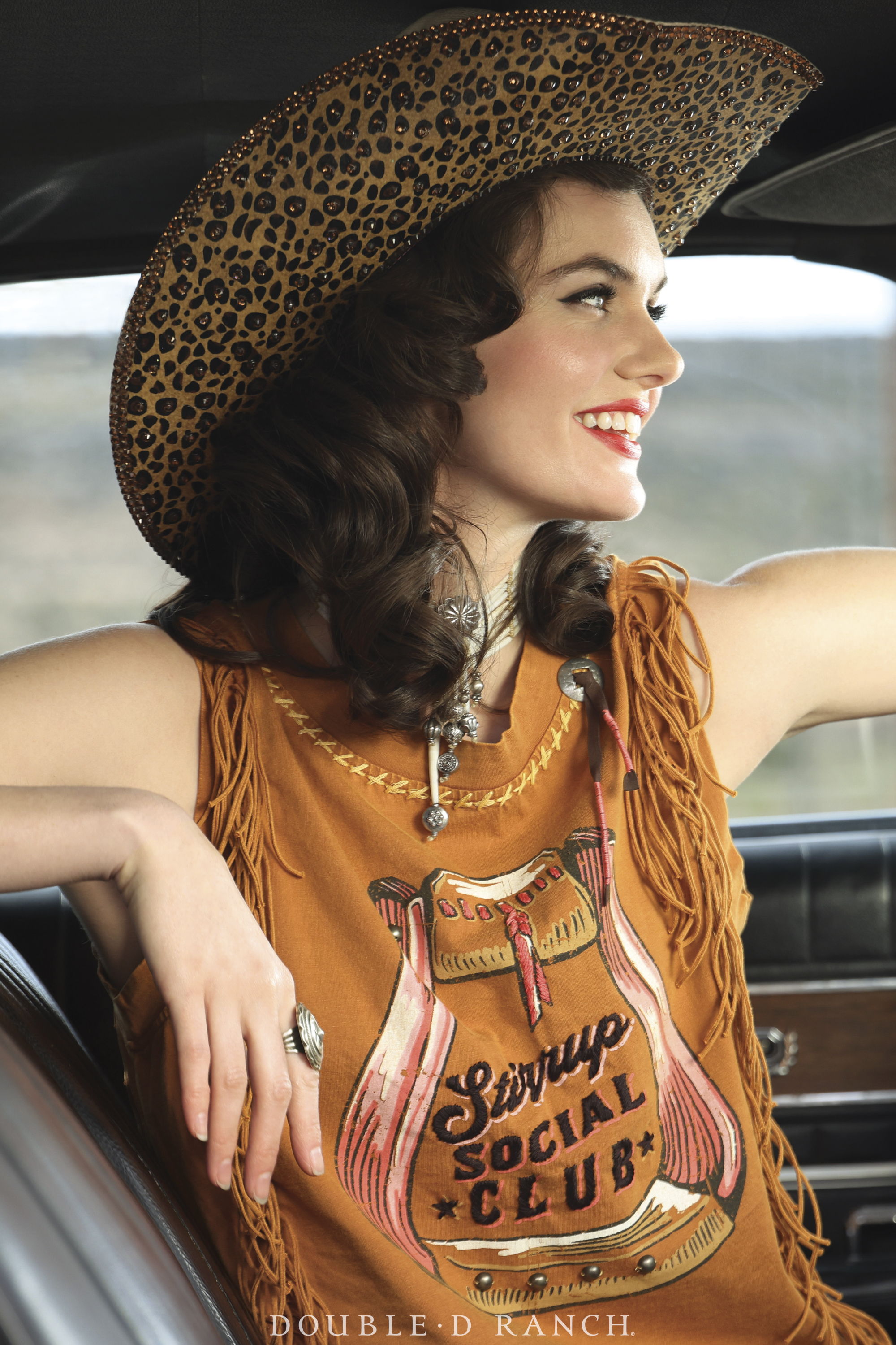 Kaylin wearing the Stirrup Social Club Top from the Rhinestone Suits and Cowboy Boots Collection.