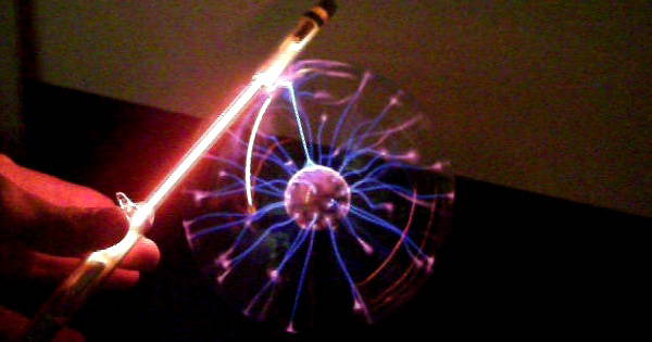 Neon gas spectrum tube near the plasma globe