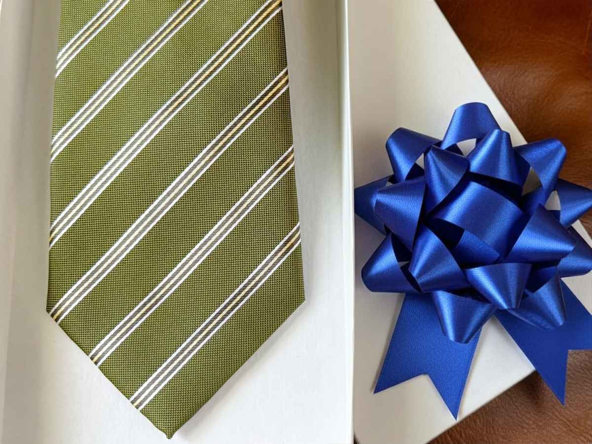 Green pencil striped necktie in a gift box