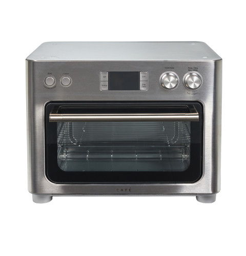 Stainless steel countertop oven with a glass door and digital display.