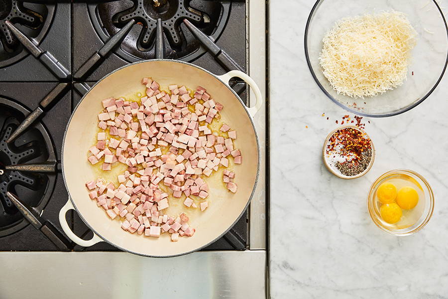 Garlic removed from pan, pancetta added to pan