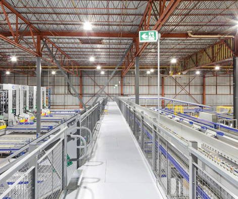 Cogan catwalk mezzanines installed throughout busy production area.