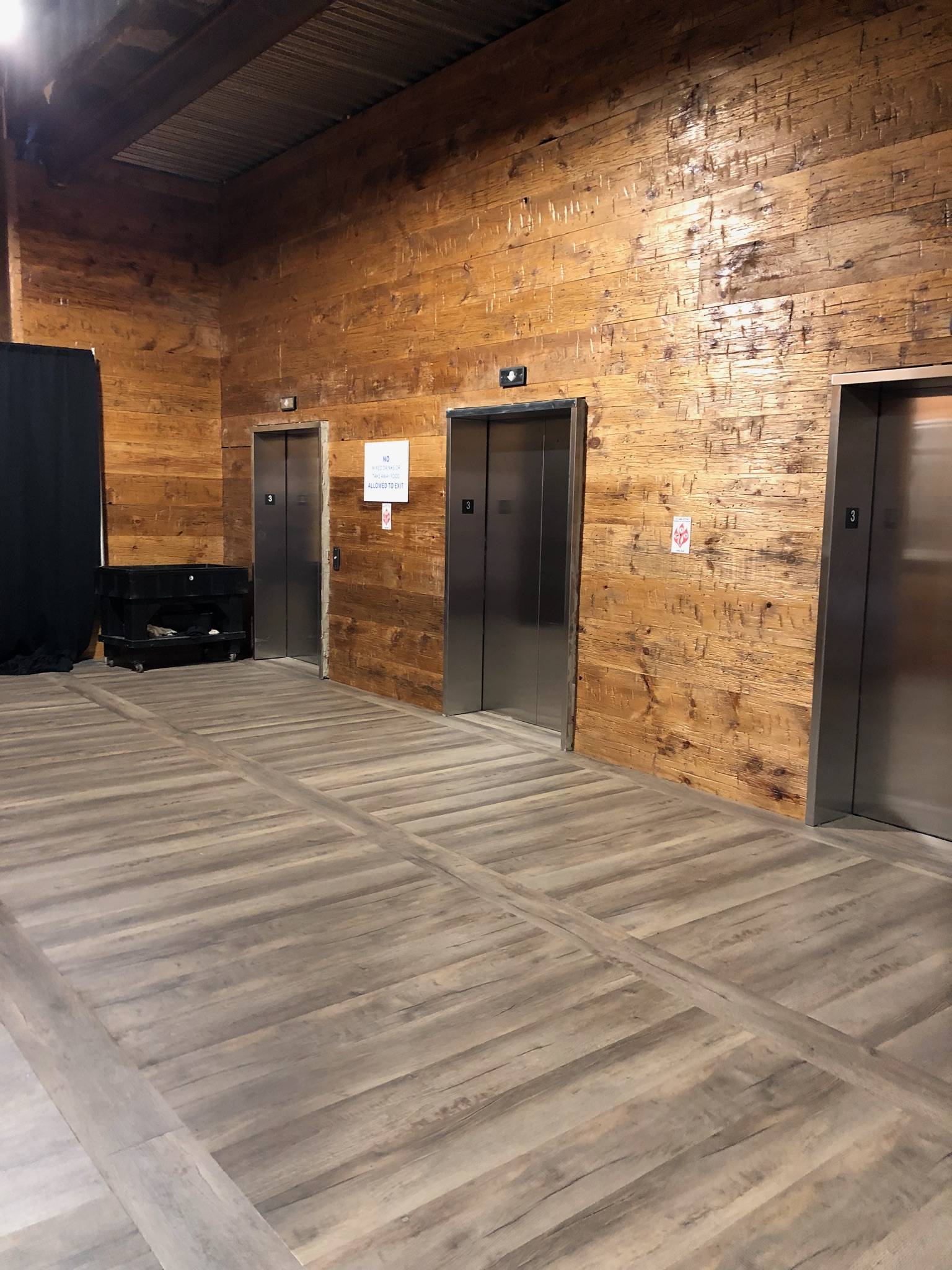 Old wood surfaced wall with elevators