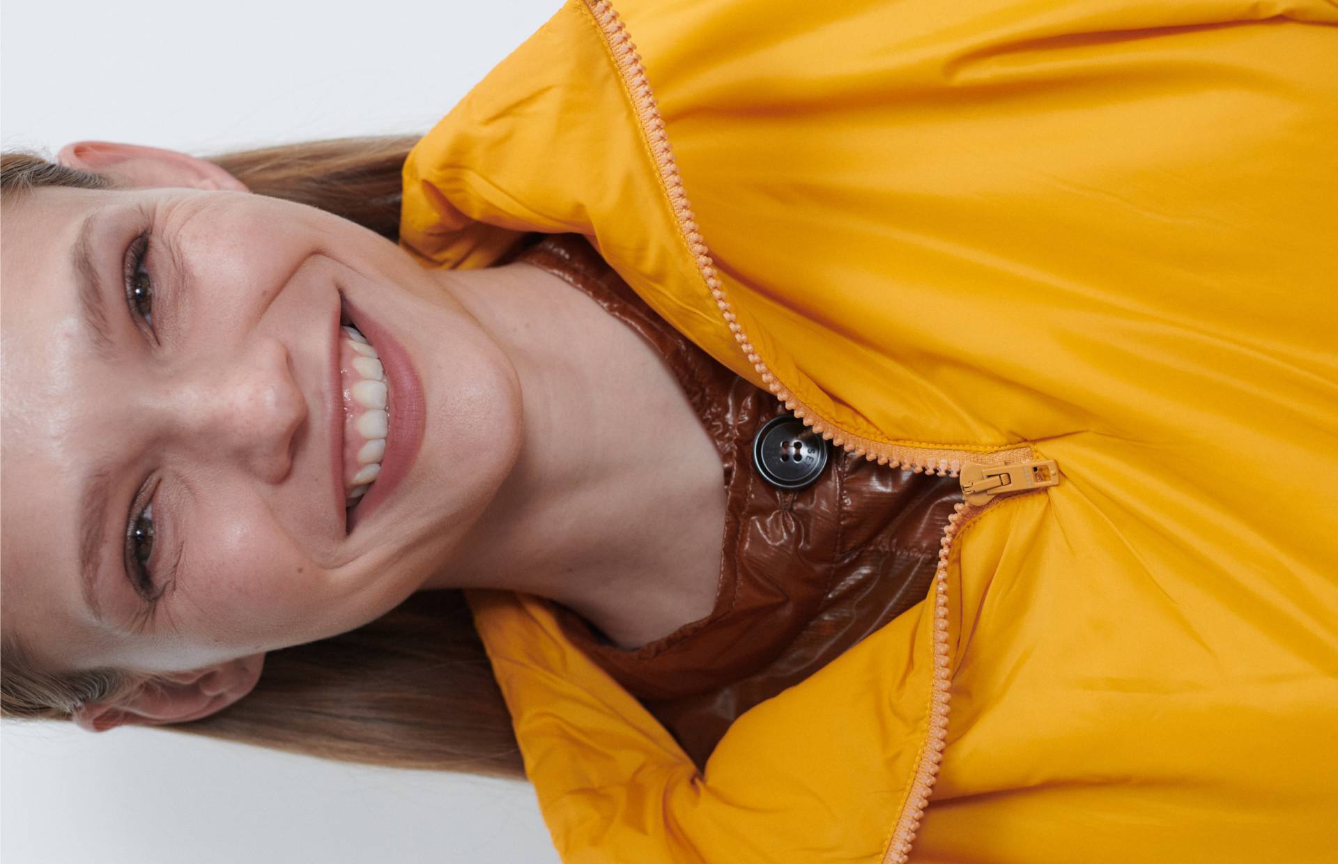 woman smiling in bright anorak