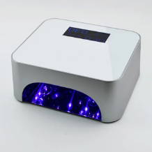 UV nail lamp with blue LED lights for curing nail polish.