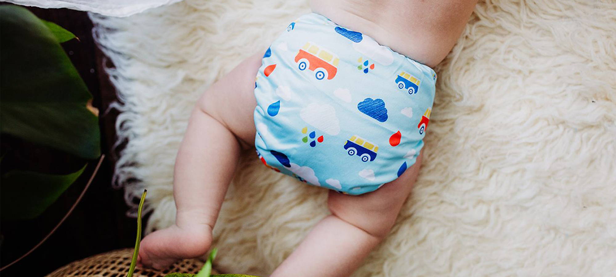 Planes Trains baby dreaming about some Simple Being cloth diapers. Looking utterly comfortable in his stylish pair of diapers.