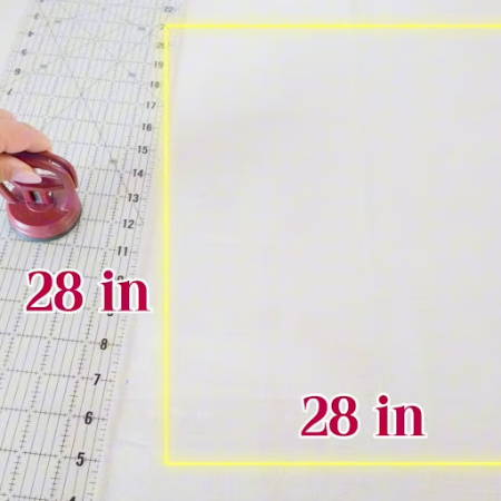 Measuring outer fabric into a 28-inch square for the flower bag