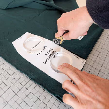 Rotary cutter cutting around a pattern piece