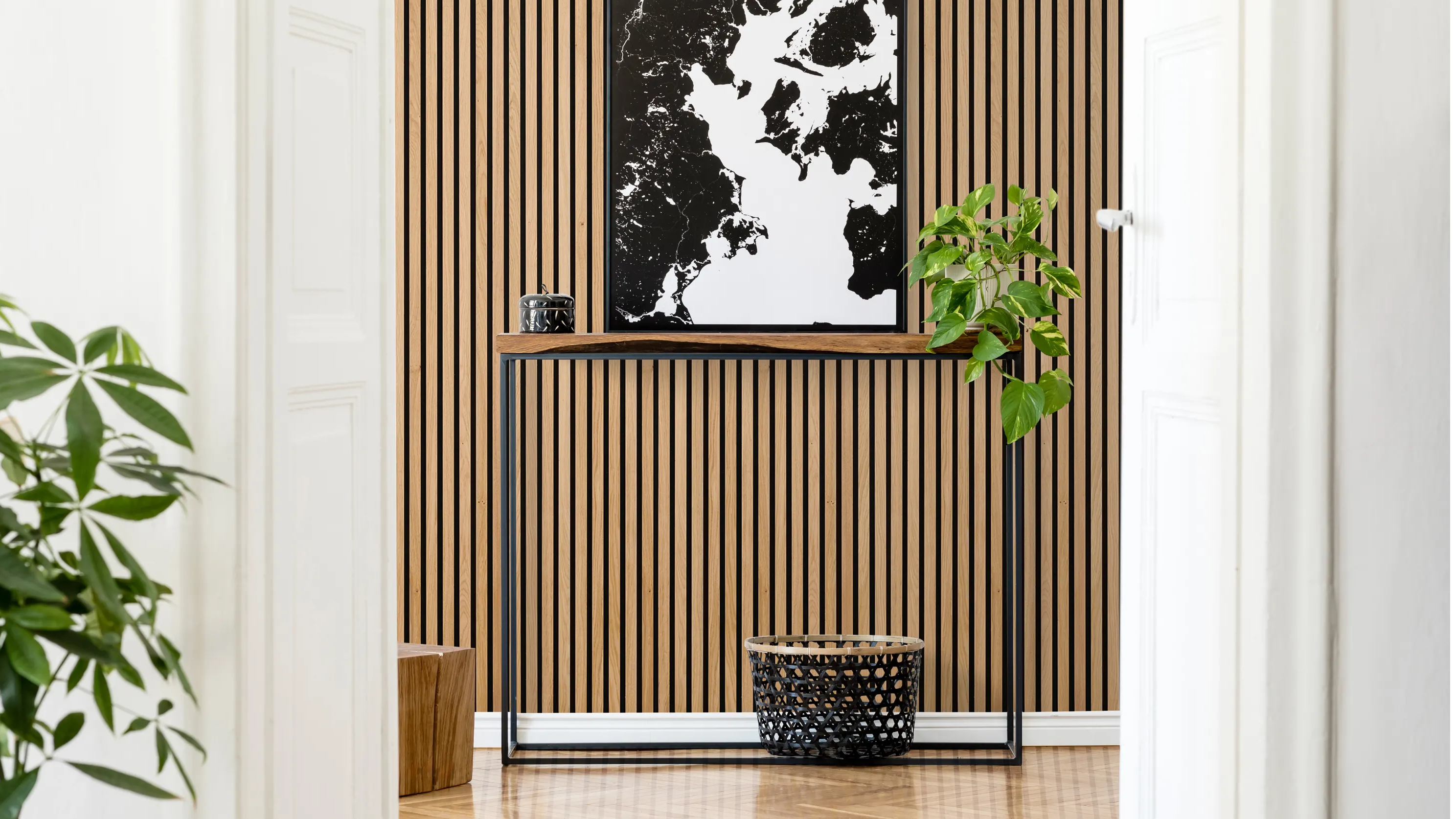 Oak acoustic slat wood wall paneling installed in a modern hallway.
