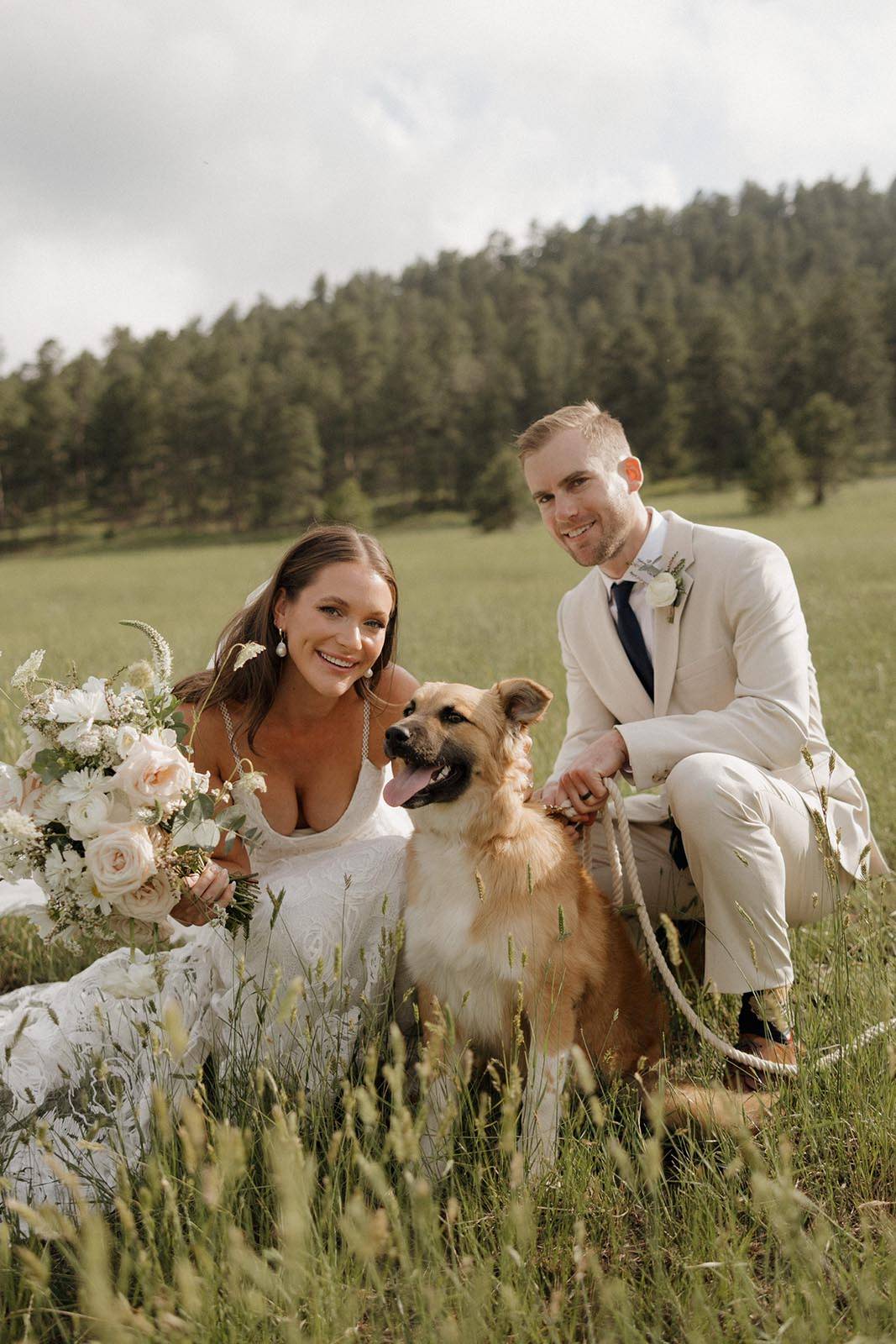 Bride and groom, alongside their lovely dog