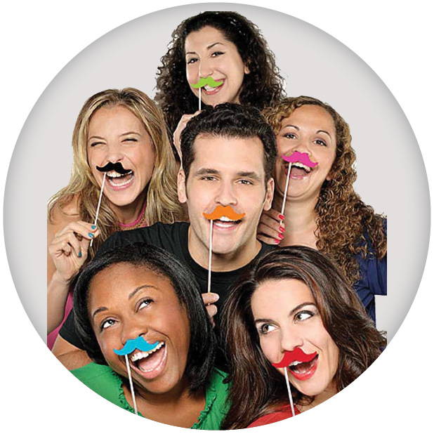 Image of six people holding multicoloured moustaches. Shop all photo booth props.